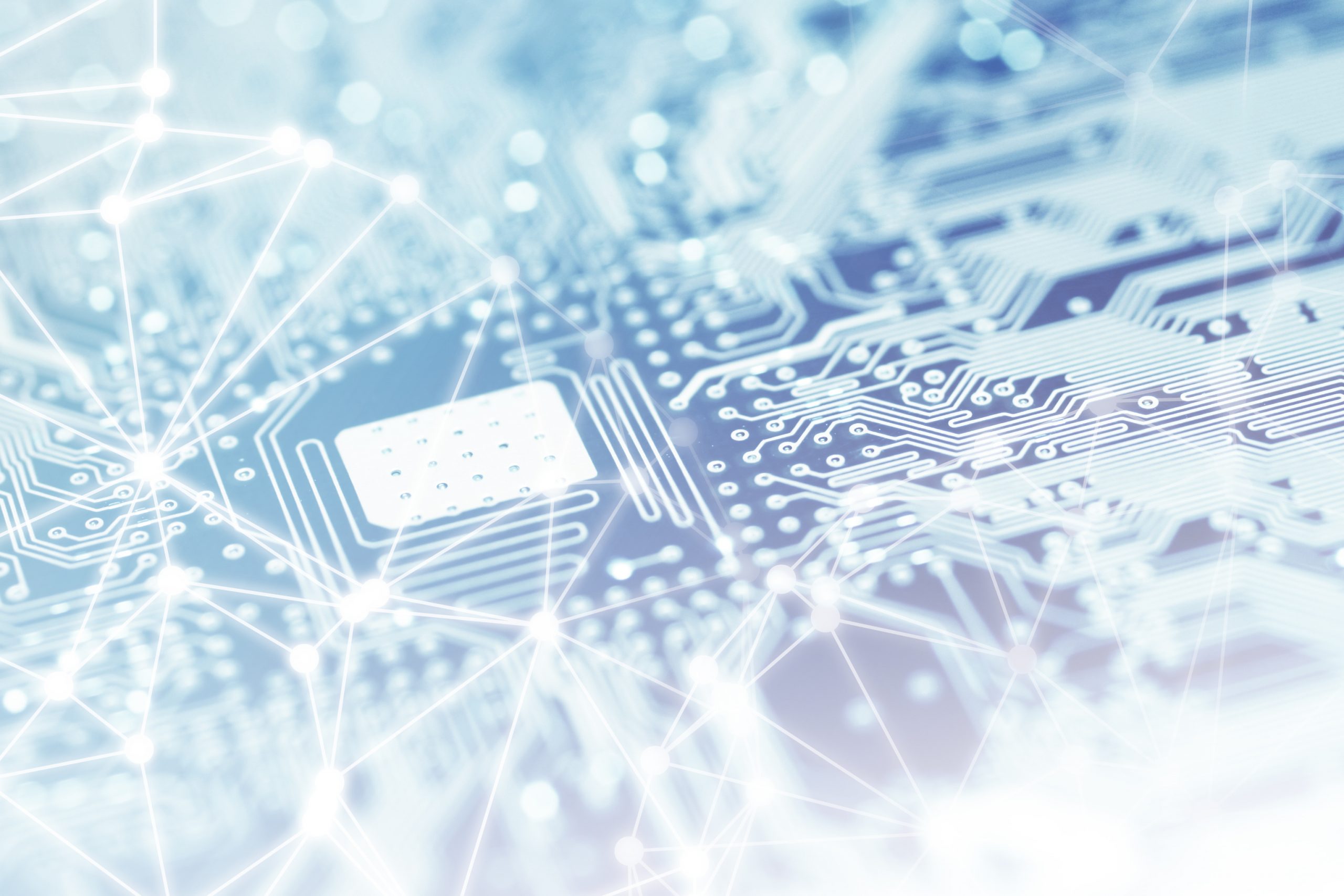 Close-up of shiny computer processor chips on motherboard with network and blockchain patterns.